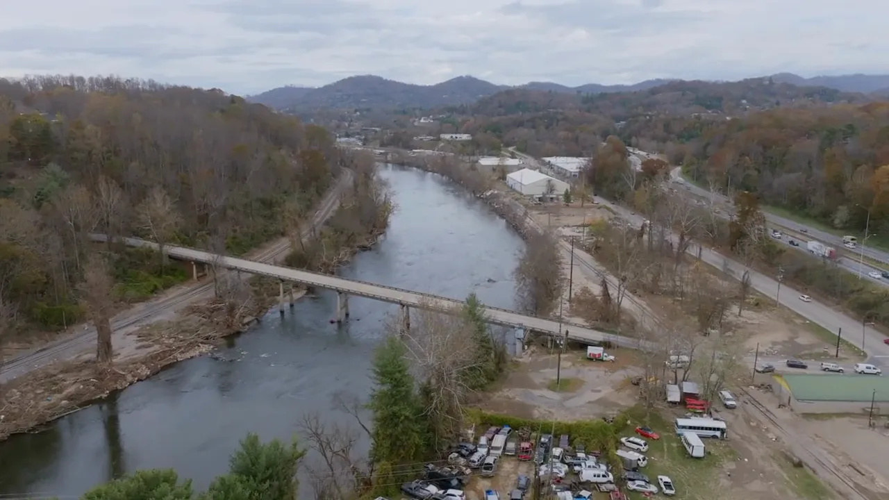 Aerial view of Asheville's river and mountain landscape